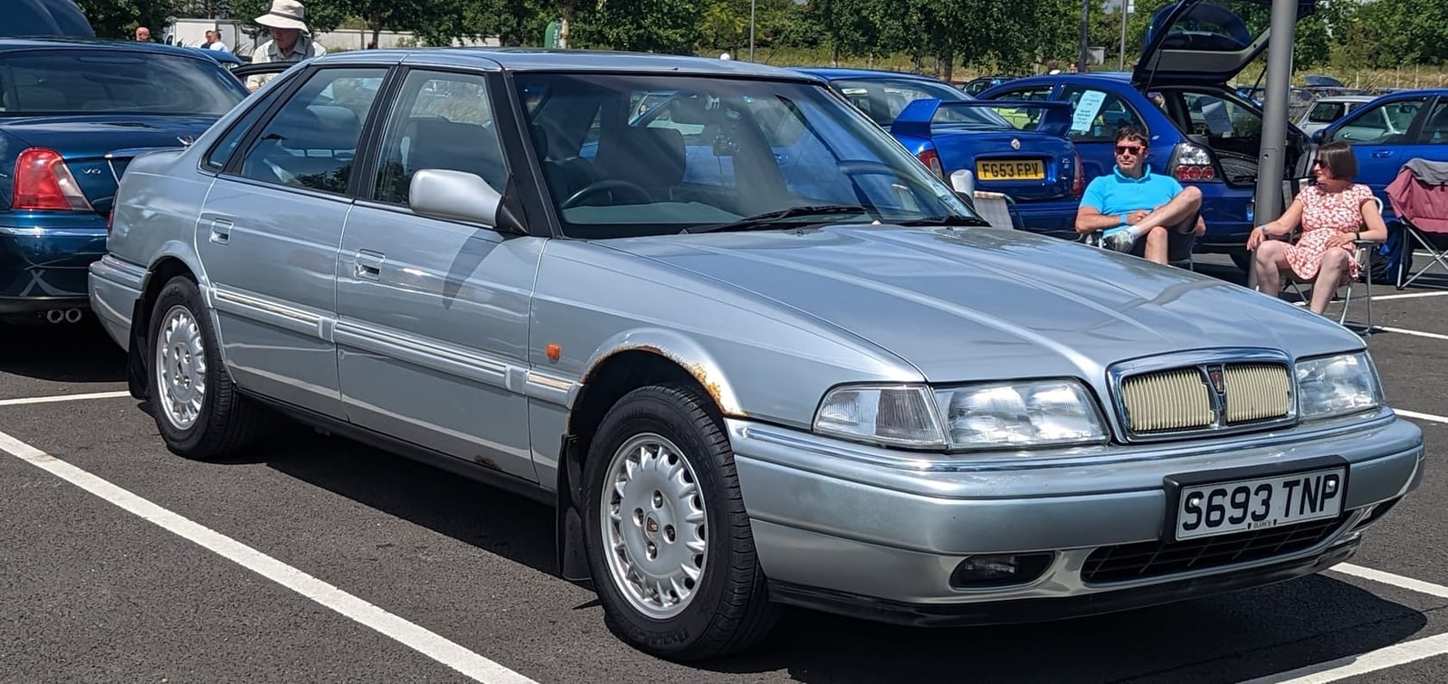 A silver 1998 Rover 820 Sterling automatic saloon with a UK registration on a show field