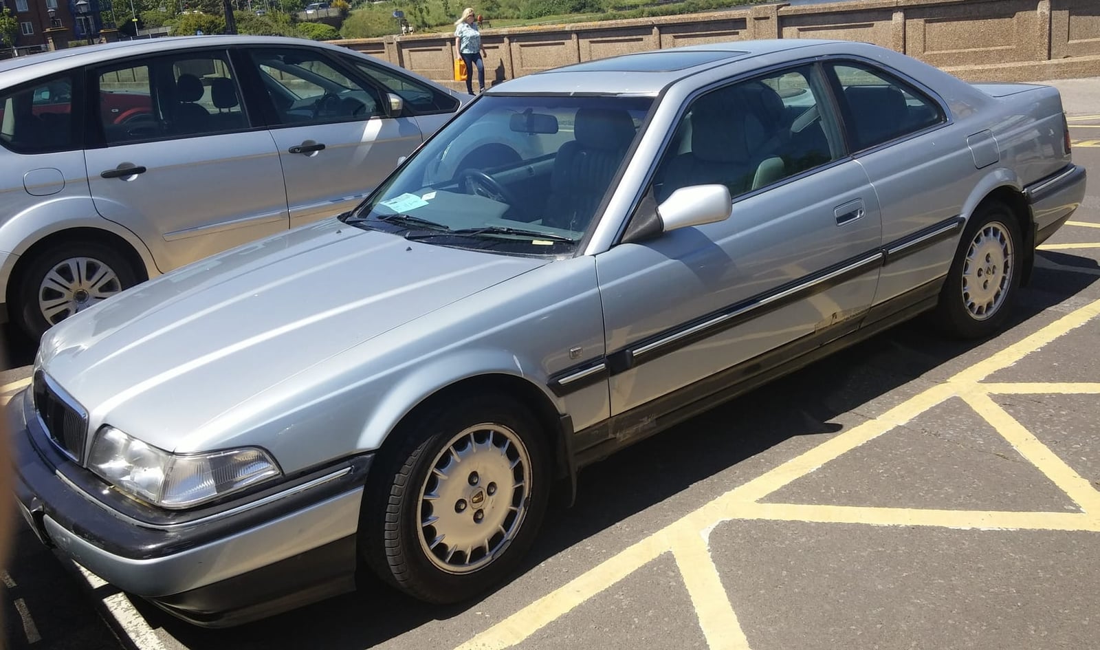 A silver 1993 Rover 800 coupé with a UK registration parked in a car park